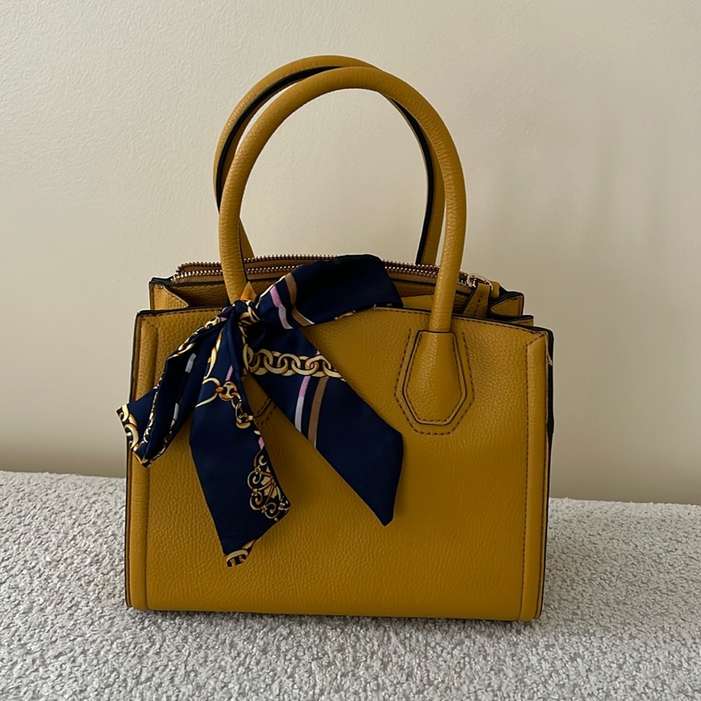 Mustard Yellow Top Handle Leather Bag with strap.